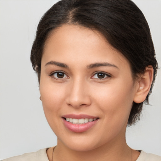 Joyful white young-adult female with medium  brown hair and brown eyes