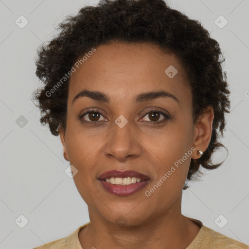 Joyful black young-adult female with short  brown hair and brown eyes