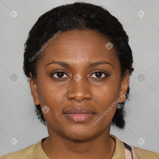 Joyful latino young-adult female with short  black hair and brown eyes