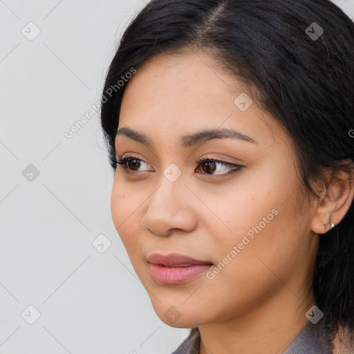 Joyful latino young-adult female with medium  black hair and brown eyes