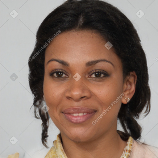 Joyful black adult female with medium  brown hair and brown eyes