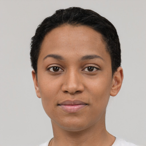 Joyful latino young-adult female with short  black hair and brown eyes