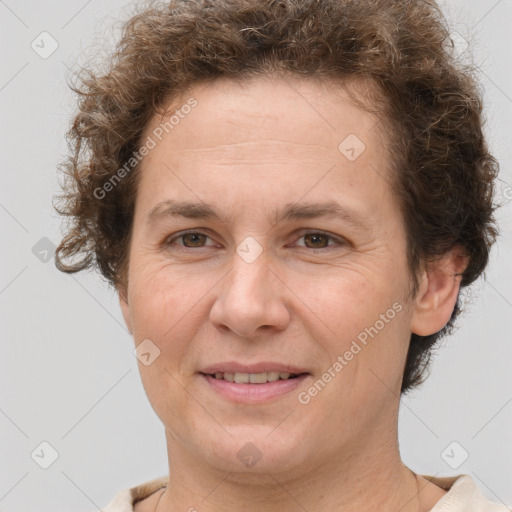 Joyful white adult female with short  brown hair and brown eyes