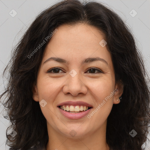 Joyful white adult female with long  brown hair and brown eyes