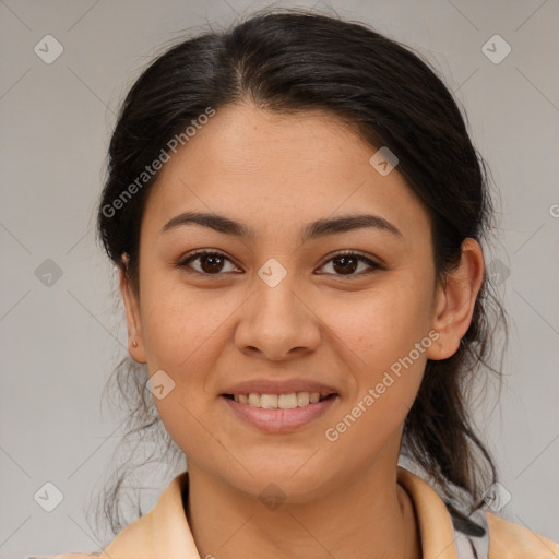 Joyful latino young-adult female with medium  brown hair and brown eyes