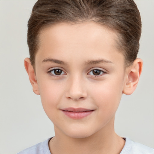 Joyful white child female with short  brown hair and brown eyes