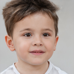 Joyful white child male with short  brown hair and brown eyes