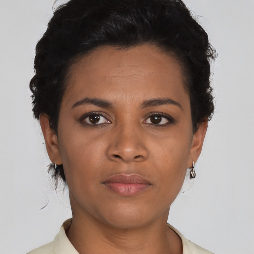 Neutral latino young-adult female with short  black hair and brown eyes