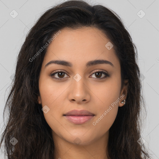 Joyful latino young-adult female with long  brown hair and brown eyes