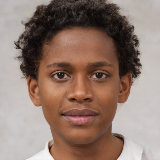 Joyful black young-adult male with short  brown hair and brown eyes