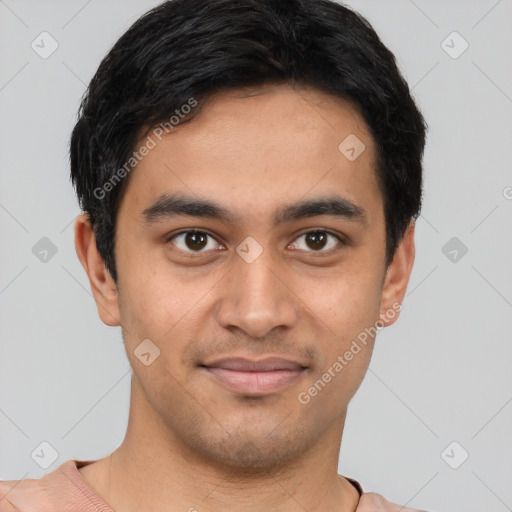 Joyful latino young-adult male with short  black hair and brown eyes