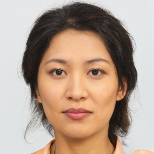 Joyful asian young-adult female with medium  brown hair and brown eyes