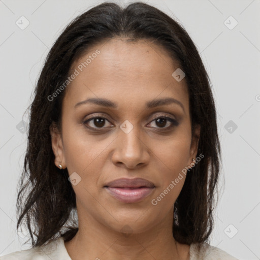 Joyful black young-adult female with medium  brown hair and brown eyes