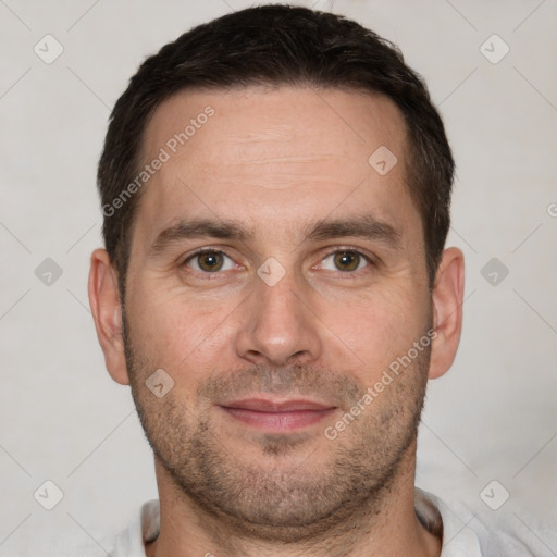 Joyful white adult male with short  brown hair and brown eyes