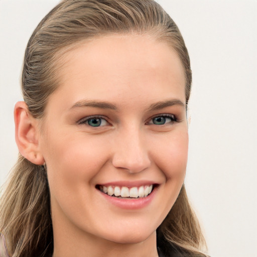 Joyful white young-adult female with long  brown hair and blue eyes