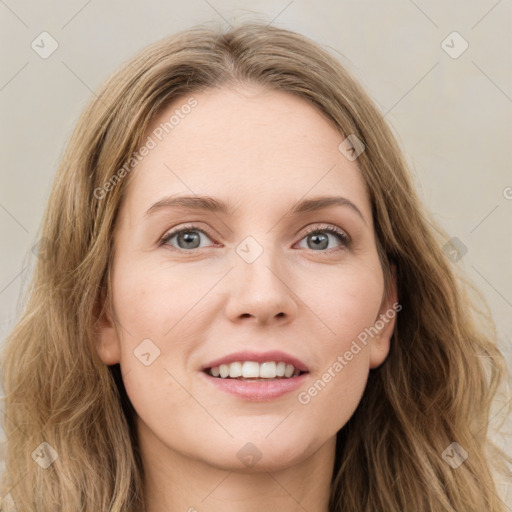 Joyful white young-adult female with long  brown hair and blue eyes