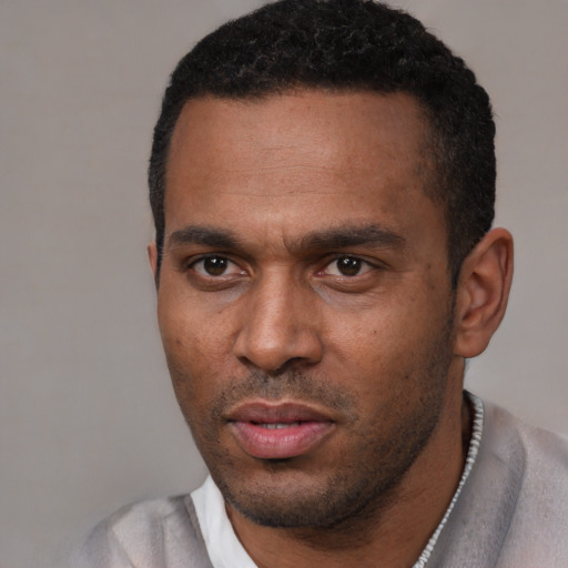 Neutral black young-adult male with short  black hair and brown eyes