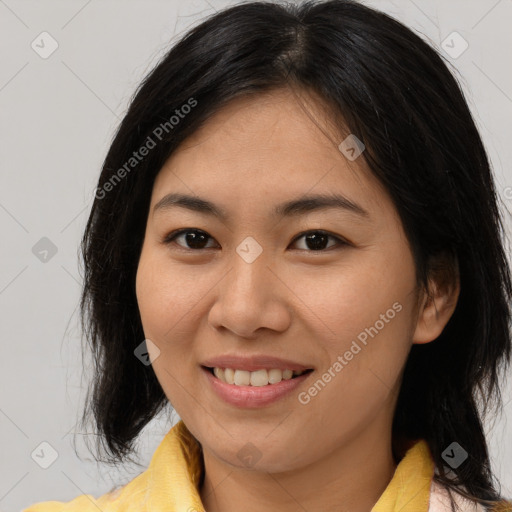 Joyful asian young-adult female with medium  brown hair and brown eyes