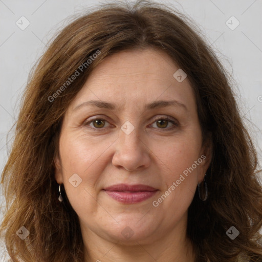 Joyful white adult female with long  brown hair and green eyes