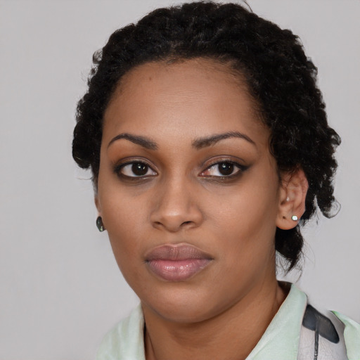 Neutral black young-adult female with short  black hair and brown eyes