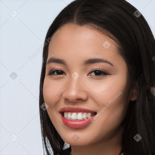 Joyful white young-adult female with long  black hair and brown eyes