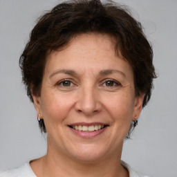 Joyful white adult female with short  brown hair and brown eyes