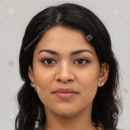 Joyful latino young-adult female with long  brown hair and brown eyes