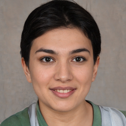 Joyful white young-adult female with short  brown hair and brown eyes