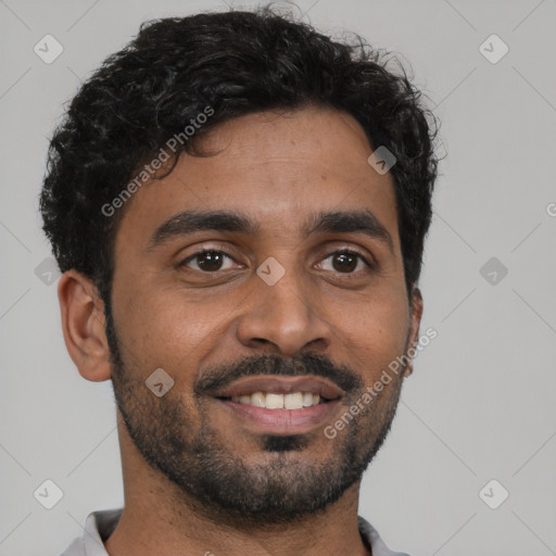 Joyful black young-adult male with short  black hair and brown eyes