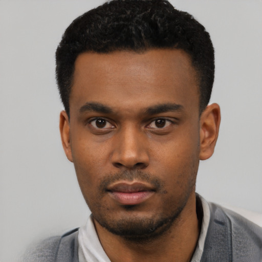 Neutral latino young-adult male with short  black hair and brown eyes