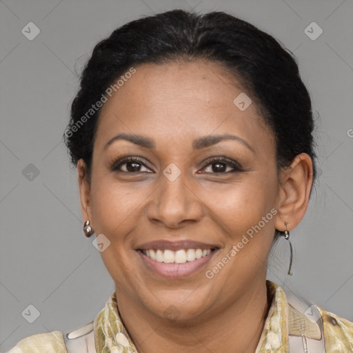 Joyful latino adult female with medium  brown hair and brown eyes