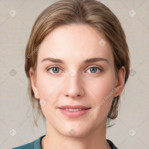 Joyful white young-adult female with medium  brown hair and blue eyes