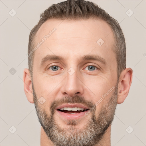 Joyful white adult male with short  brown hair and brown eyes