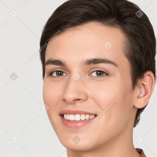 Joyful white young-adult female with short  brown hair and brown eyes