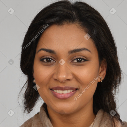 Joyful latino young-adult female with medium  brown hair and brown eyes