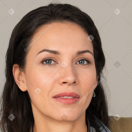 Joyful white adult female with long  brown hair and brown eyes