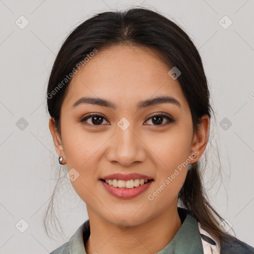 Joyful latino young-adult female with medium  brown hair and brown eyes