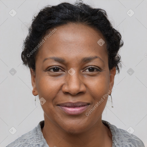 Joyful black adult female with short  brown hair and brown eyes