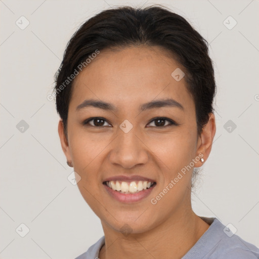 Joyful asian young-adult female with short  black hair and brown eyes