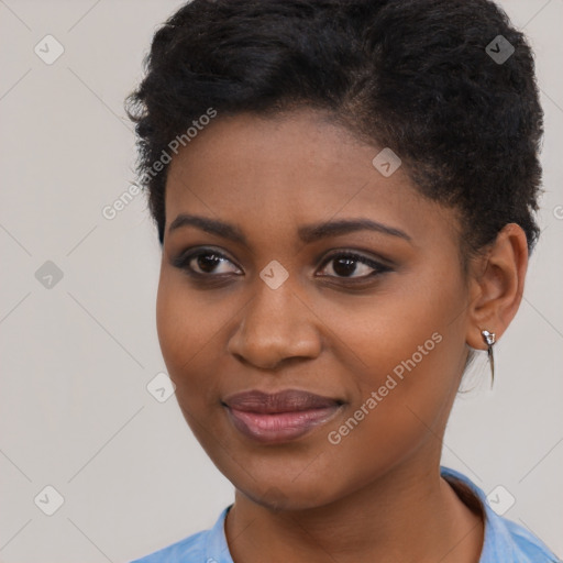 Joyful black young-adult female with short  brown hair and brown eyes