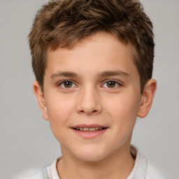 Joyful white child male with short  brown hair and brown eyes