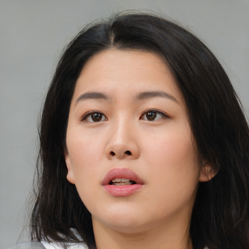 Neutral asian young-adult female with long  brown hair and brown eyes