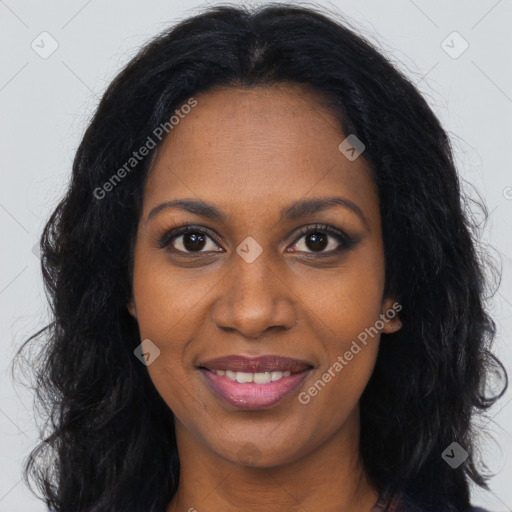 Joyful black young-adult female with long  brown hair and brown eyes