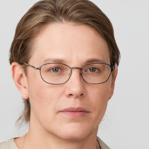 Joyful white adult female with short  brown hair and grey eyes