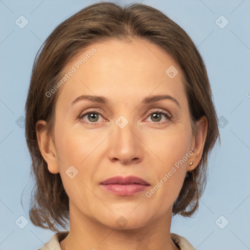 Joyful white adult female with medium  brown hair and grey eyes