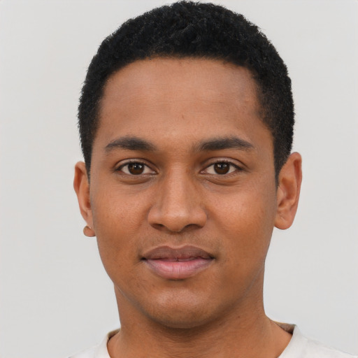 Joyful black young-adult male with short  black hair and brown eyes