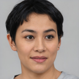 Joyful asian young-adult female with short  brown hair and brown eyes