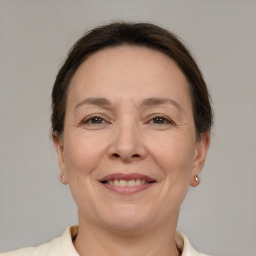 Joyful white adult female with short  brown hair and brown eyes