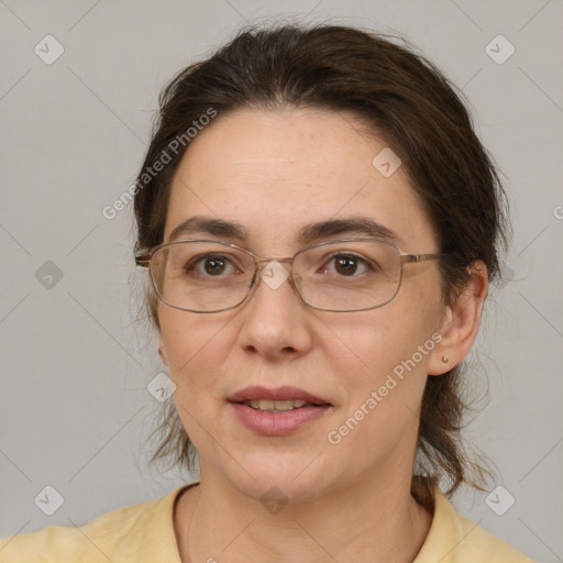 Joyful white adult female with medium  brown hair and brown eyes