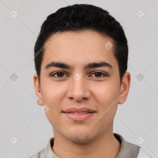 Joyful latino young-adult male with short  black hair and brown eyes